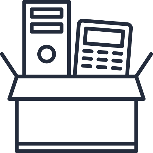 A cardboard box sits open, revealing a desktop computer tower and a calculator inside. The items appear ready for shipping or storage, suggesting IT equipment disposal or relocation.