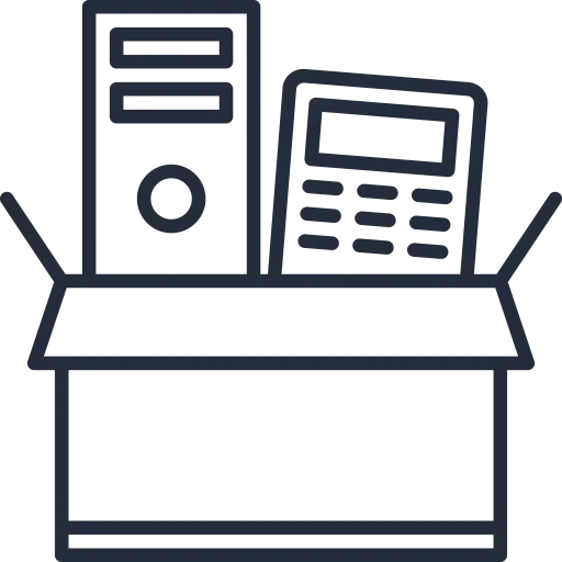 A cardboard box sits open, revealing a desktop computer tower and a calculator inside. The items appear ready for shipping or storage, suggesting IT equipment disposal or relocation.